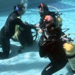 Dive Masters - Learning remove and replace scuba unit underwater skill Dive Masters - Learning remove and replace scuba unit underwater skill